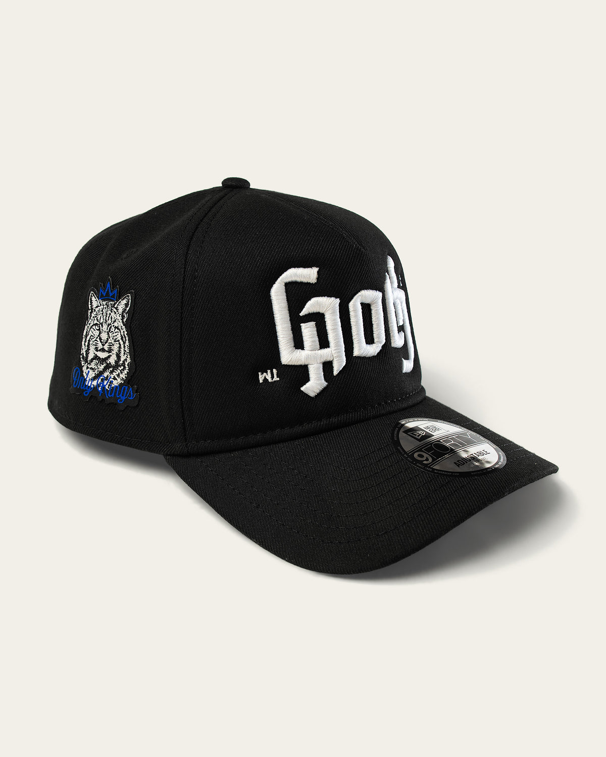 Only Kings × Cap in black, three-quarter front with the GOTH ambigram and the crowned Wildcat patch