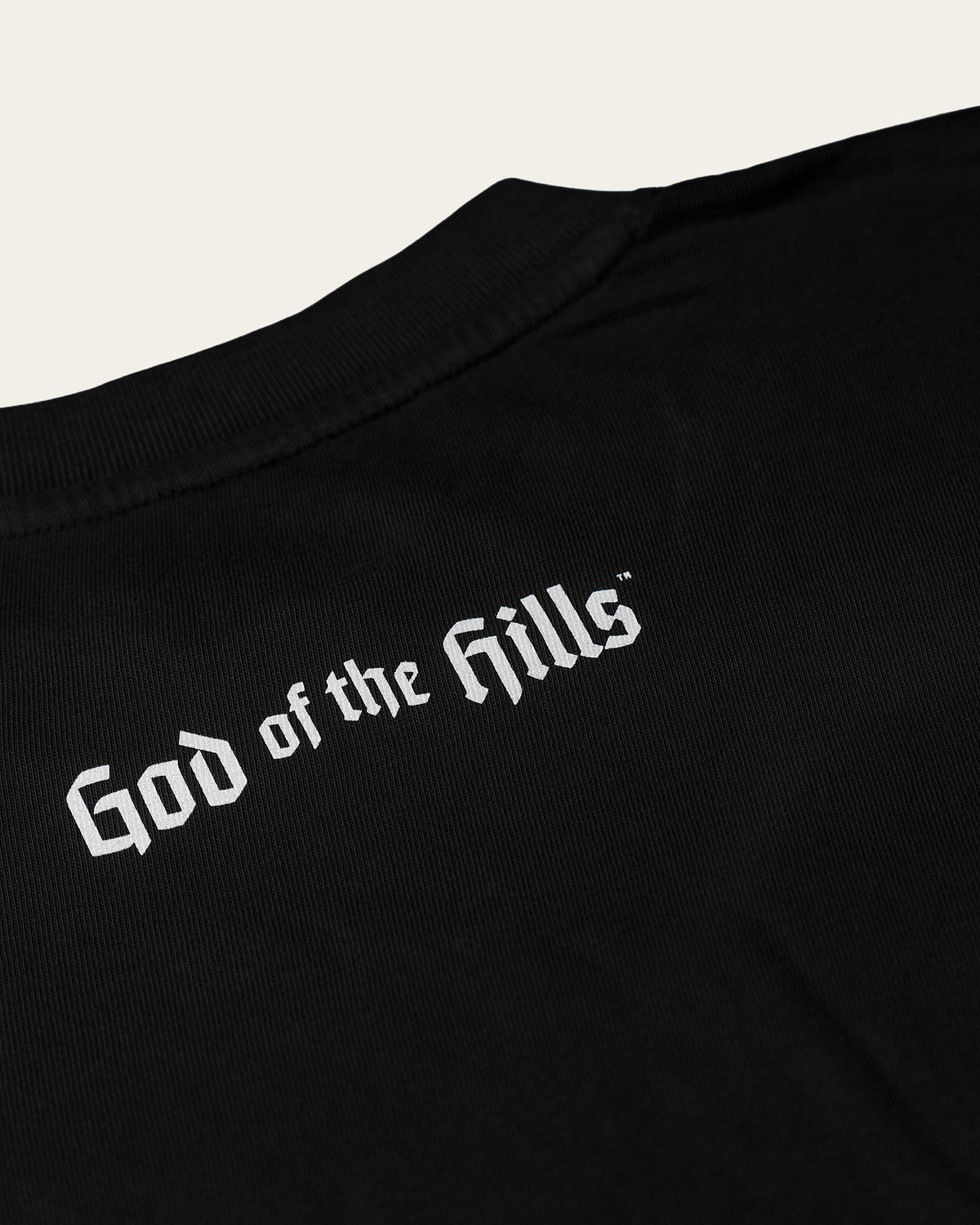 Only Kings × Wildcat Tee in pigment black, back with the God of the Hills wordmark