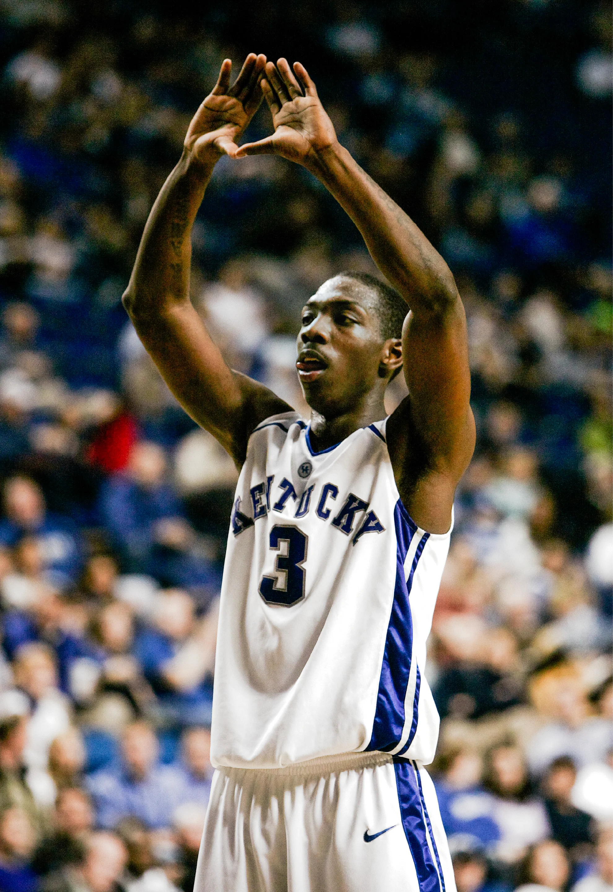 Ramel Bradley in his Kentucky number 3 jersey at the Auburn game, January 10, 2007, hands raised above his head.
